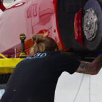 Euromotion technician examining a car.