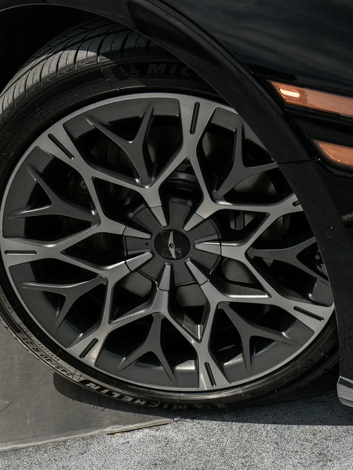 Close-up of a Genesis alloy wheel and tire