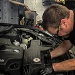 Euromotion technician working on a BMW engine